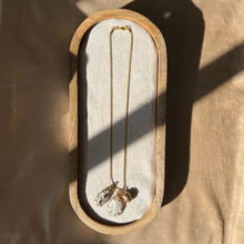 Load image into Gallery viewer, Touchstone Pendant Necklace: 18k gold plated chain with mother of pearl, shell, and bronze rattle pendants