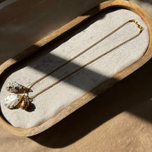Load image into Gallery viewer, Touchstone Pendant Necklace: 18k gold plated chain with mother of pearl, shell, and bronze rattle pendants