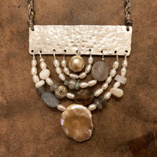 Load image into Gallery viewer, Measure Necklace: Four arching rainbows of white pearls, lace agate, labradorite, and a little silver buddah head, are suspended below a sterling silver bar sawed and textured to look like an abstract ruler. The necklace 'chain' is made up of hand-woven nylon thread.