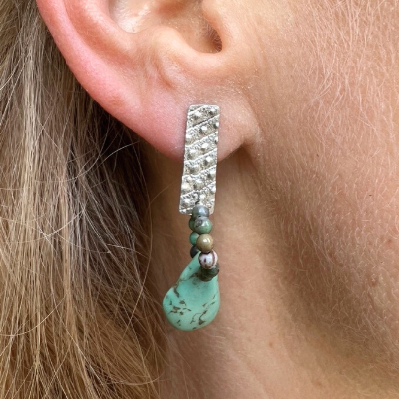 Post Earrings: Textured Silver with a natural turquoise teardrop
