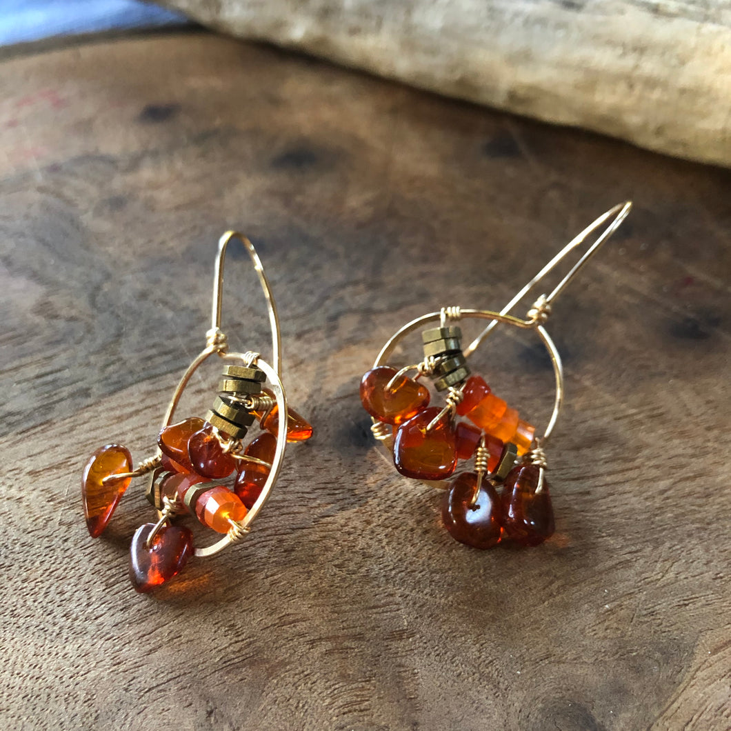 Earrings: Glass half full style in gold fill wire with amber and carnelian beads