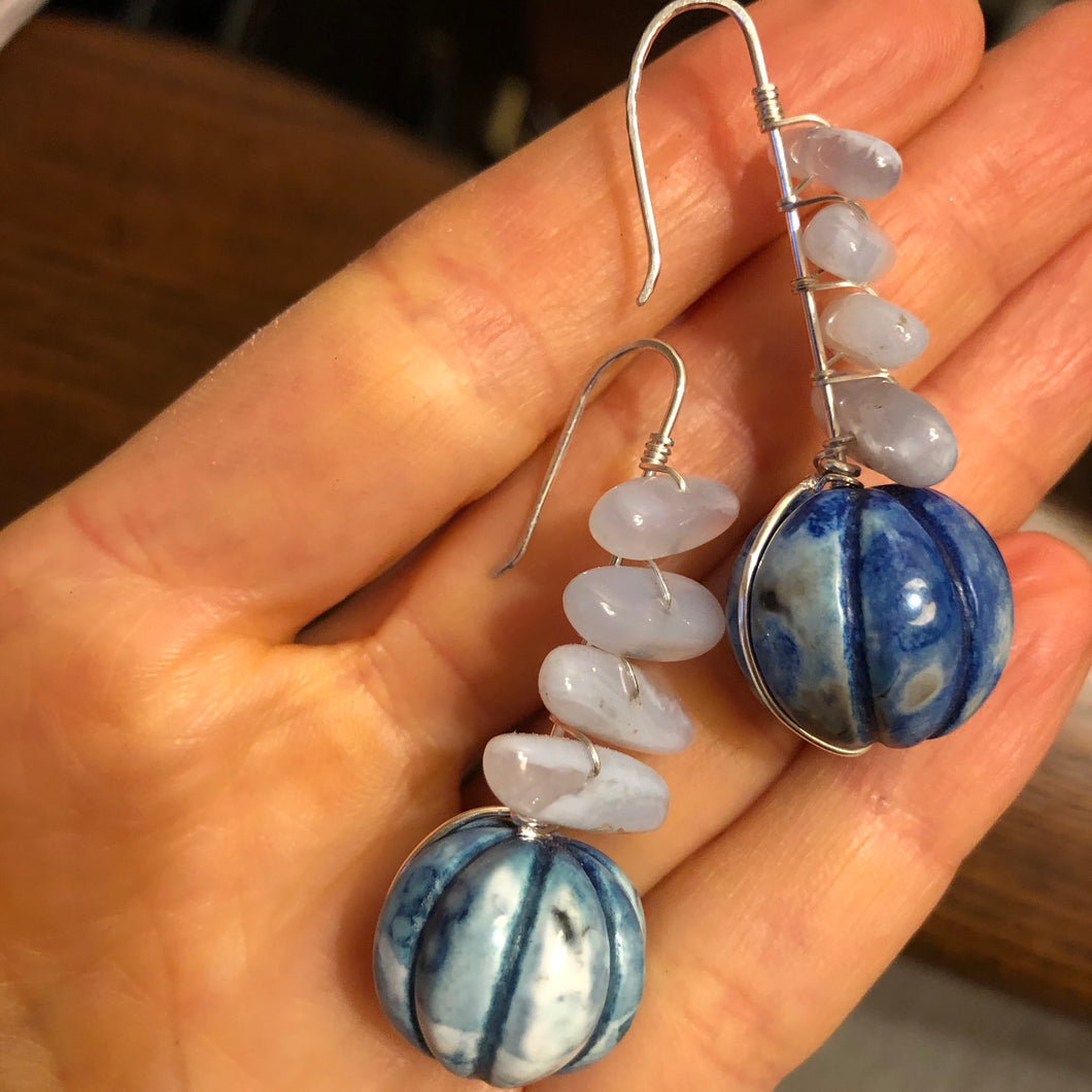 Earrings: carved blue celestite and lace agate on sterling silver.